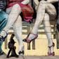 A woman walks past a mural featuring tango dancers in Buenos Aires