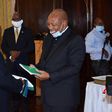 Lesotho's former prime minister Thomas Thabane (L) said he "may have inadvertently erred" during his term, as he handed power to Moeketsi Majoro