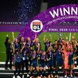 Lyon skipper Wendie Renard lifts the trophy after her team beat Wolfsburg