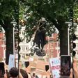 Sequence of pictures showing demonstrators pulling down the bronze monument to Edward Colston in Bristol and threw it into the harbour