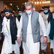 Pakistan's Foreign Minister Shah Mehmood Qureshi (third right) walks with Taliban co-founder Mullah Abdul Ghani Baradar (second left) ahead of talks in Islamabad intended to push for peace talks