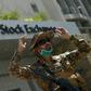 A paramilitary soldier gestures while standing guard outside the Pakistan Stock Exchange  after gunmen attacked the building