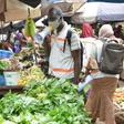 The defiant mood is deepened by the need to make a living. At a Conakry market, the Red Cross spreads the word on fighting the virus
