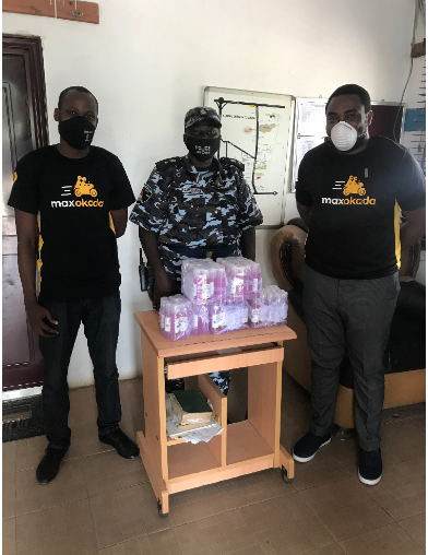 Mr. Gbolahan Fadipe of Max.ng, CSP Sola Omilade, DPO, Alausa Police Station and Mr. Afam Anyika also of Max.ng during the presentation of personal safety kits to the Alausa Police Command, Ikeja recently.