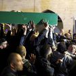 Thousands of mourners attended the funeral of Iyad Hallak