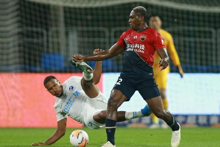 Shenzhen FC's John Mary (R) says he was racially abused during a match against Shanghai Shenhua