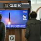 People watch footage of a North Korean missile test at a railway station in Seoul
