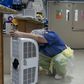 A medical worker rests in front of a fan in the COVID-19 intensive care unit at United Memorial Medical Center in Houston, Texas