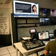 Employees of ABS-CBN work in the editing booth at the station headquarters in Manila on May 6, 2020 before it was forced to shut down