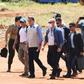 Brazilian President Jair Bolsonaro (3-L), who has scorned social distancing measures to combat COVID-19, is pictured here without a mask as he visits the site of a field hospital under construction in Aguas Lindas, Goias State to handle virus cases