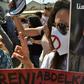 Algerians carry portraits of journalist Khaled Drareni during a rally to protest against his imprisonment in the capital Algiers on September 7