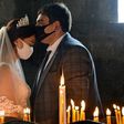 Conspiracy claims and alleged failure to take the virus threat seriously have seen cases incrase in Armenia -- here a bride and a bridegroom did don masks for their wedding at Saghmosavan near the capital