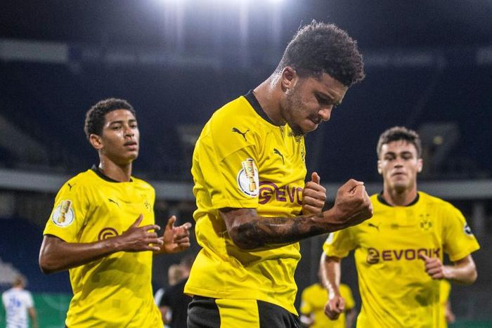 England winger Jadon Sancho (C) celebrates scoring against Duisburg on Monday in the first round of the German Cup