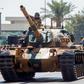 Turkish troops parade atop armoured vehicles in the northern part of Nicosia, the capital of the self-proclaimed Turkish Republic of Northern Cyprus on July 20, 2020, to mark the 46th anniversary of the Turkish invasion in 1974.