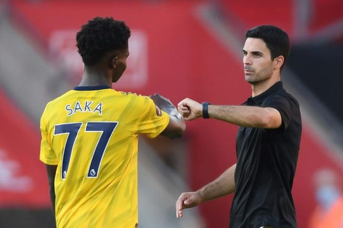 Arsenal coach Mikel Arteta (right) is a big fan of Bukayo Saka (left)