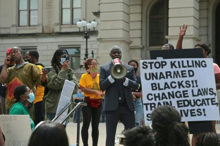 Protestors in Atlanta demonstrate on June 15 against the police shooting of 27-year-old Rayshard Brooks, during a confrontation after Brooks was found asleep in his car at a fast food restaurant