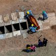 An aerial view of a burial is seen at the Bom Jardim cemetery, the largest public cemetery in Fortaleza, Ceara state, Brazil on May 7, 2020, as many of the burials were of people who were confirmed or suspected to have died from COVID-19
