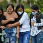 Relatives of Heine Collazos and Esneider Collazos, two of six men massacred by an armed group on August 21 in a rural area Colombia, attend their funeral