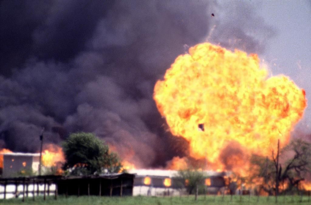 The Branch Davidian compound explodes in massive flames on April 19, 1993, ending the standoff between cult leader David Koresh and his followers and the FBI near Waco, Texas.