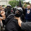 A member of the Antifa group is held back while he argues with a Trump supporter during a rally of right-wing groups in Washington on July 6, 2019.