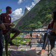 Volunteers wait to help with disinfection at the Santa Marta favela in Rio de Janeiro in April 2020