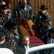 The coffin of Run-DMC's Jam Master Jay, the rapper born Jason Mizell, is carried out of a Queens Cathedral after his funeral on November 5, 2002