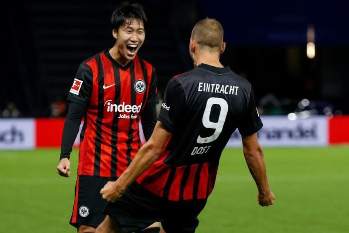 Eintrach Frankfurt's Daichi Kamada celebrates Bas Dost's goal in the Hertha Berlin win