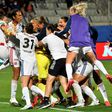 Lyon's players celebrate with Sarah Bouhaddi after she saved the key penalty