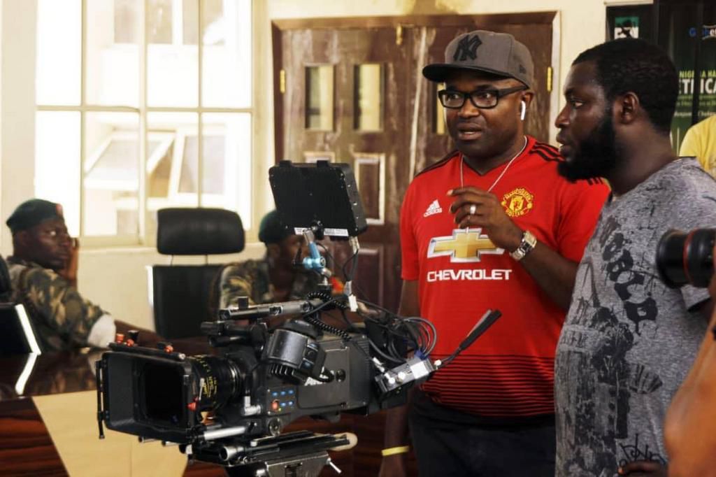 Obi Emelonye on the set of 'Badamasi' [Instagram/@obiemelonye]