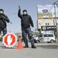 Palestinian security forces man a checkpoint at a key entrance to the city of Hebron earlier this year