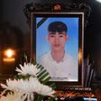 A portrait of 20-year-old Nguyen Dinh Luong, who is feared to have been among the 39 people found dead in a truck in Britain, is kept on a prayer altar at his house in Vietnam's Ha Tinh province on October 29, 2019