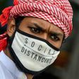 A Muslim wearing a face mask comes out of Masjid-e-Eidgah Bilal after offering prayers during the Eid al-Adha, the feast of sacrifice, in Bangalore on August 1, 2020.