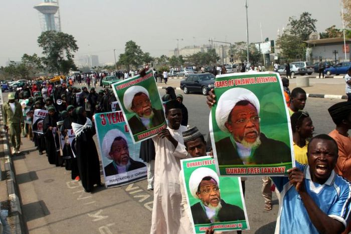 IMN leader Ibrahim Zakzaky, seen here on posters, has been in custody since he was arrested in December 2015