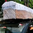Officials in hazmat suits paraded empty coffins through the streets of Jakarta to remind residents that coronavirus cases are still surging