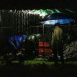 Gravediggers conduct an "express burial" at night in Managua, Nicaragua, a procedure that has become more common since the beginning of the COVID-19 pandemic