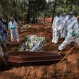 Employees bury the coffin of a person who died from COVID-19 at the Vila Formosa cemetery, in the outskirts of Sao Paulo, Brazil on May 20, 2020