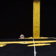 A Saudi workman adjusts the new kiswa, the gold-embroidered black cloth covering the Kaaba, that is changed during each year's hajj