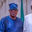 President Muhammadu Buhari rejoices with Sen. Gbenga Ashafa. [abusidiqu]