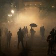Protesters stand amid tear gas near the federal courthouse in  Portland, Oregon during a rally against police brutality late on July 24, 2020