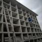 A worker builds vertical graves during the COVID-19 coronavirus pandemic at the Caju Cemetery in Rio de Janeiro, Brazil