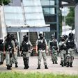 Riot police stand guard outside Hong Kong's legislature ahead of Wednesday's debate