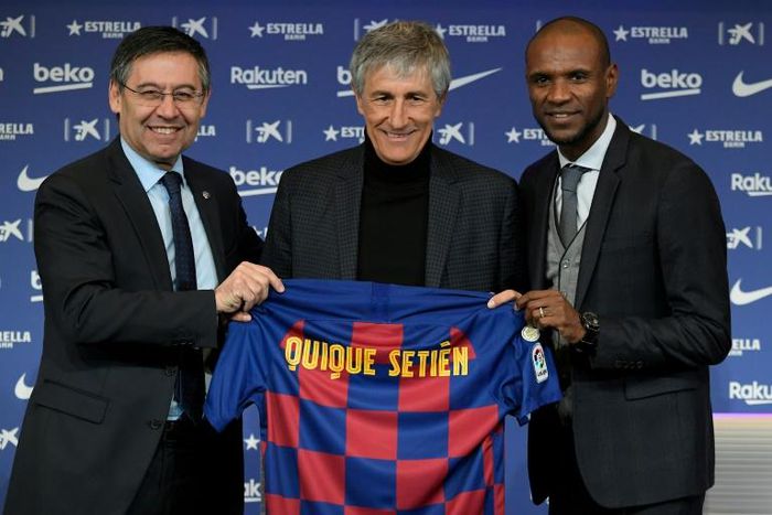 Barcelona president Josep Maria Bartomeu, left and  Eric Abidal, right, welcomed Quique Setien as coach in January. It did not work out well