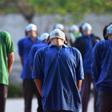 Homeless labourers staying at Yamuna stadium  in Delhi as part of India's virus lockdown do their daily exercises