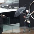 Valtteri Bottas posed with an umbrella as rain prevent practice at the Nurburgring