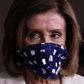 US House speaker Nancy Pelosi, seen wearing a protective mask at a May 7, 2020 briefing, has urged President Donald Trump to set an example by doing the same