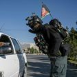 A motorist is checked by security at a checkpoint in the Afghan capital at the start of the Eid al-Fitr holiday