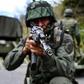 The Venezuelan military is undertaking a massive air, sea and land search for remnants of attackers the government described as "mercenaries"