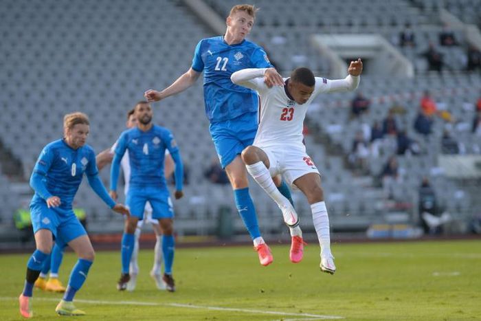 Air force: England's Mason Greenwood and Iceland's Jon Bodvarsson challenge for the ball