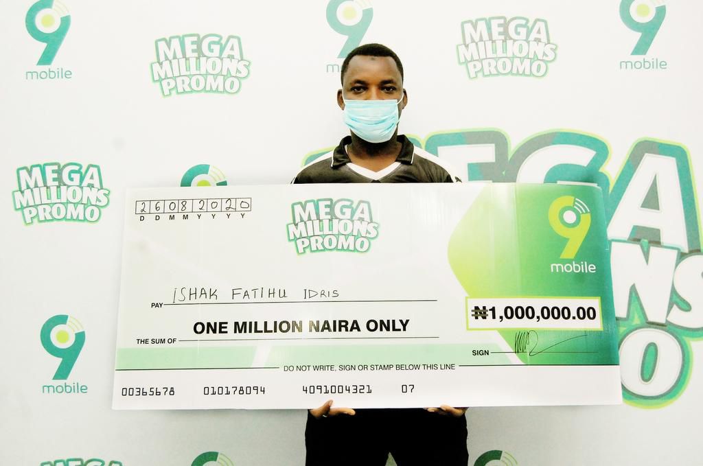 Ishak Fatihu Idris, N1million winner in the ongoing 9mobile Mega Millions Promo prize presentation in Kano