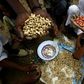 Sudanese farmers display their harvest of peanuts, a key crop hit by a government export ban